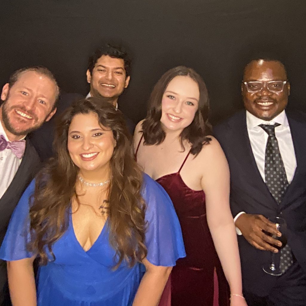 photo booth photo of several young adults smiling