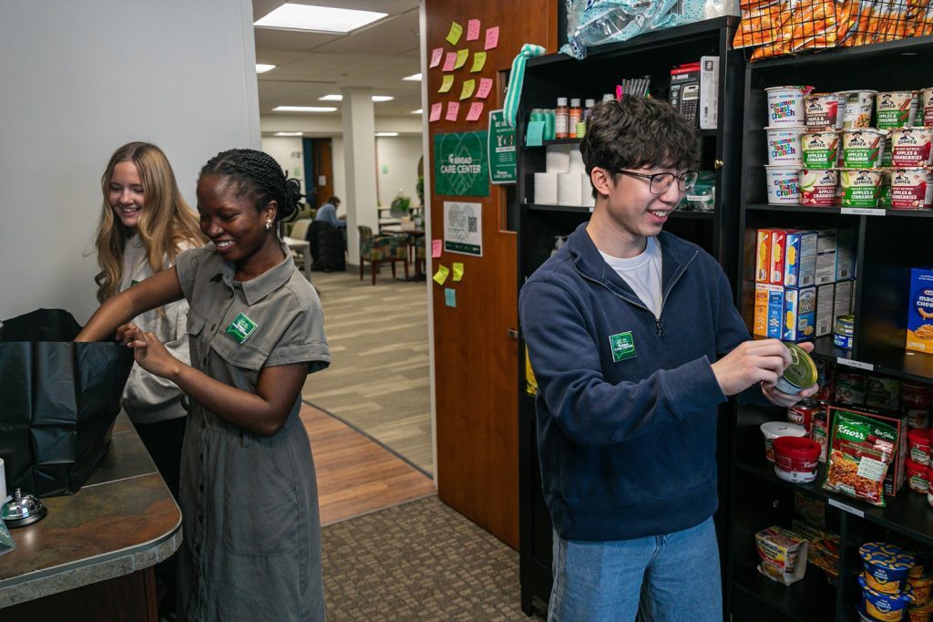 Two people working stocking supplies in a room