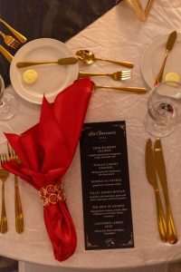 Overhead photo of Les Gourmet menu and table setting