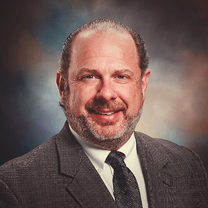 A professional headshot of Michael Hamilton.