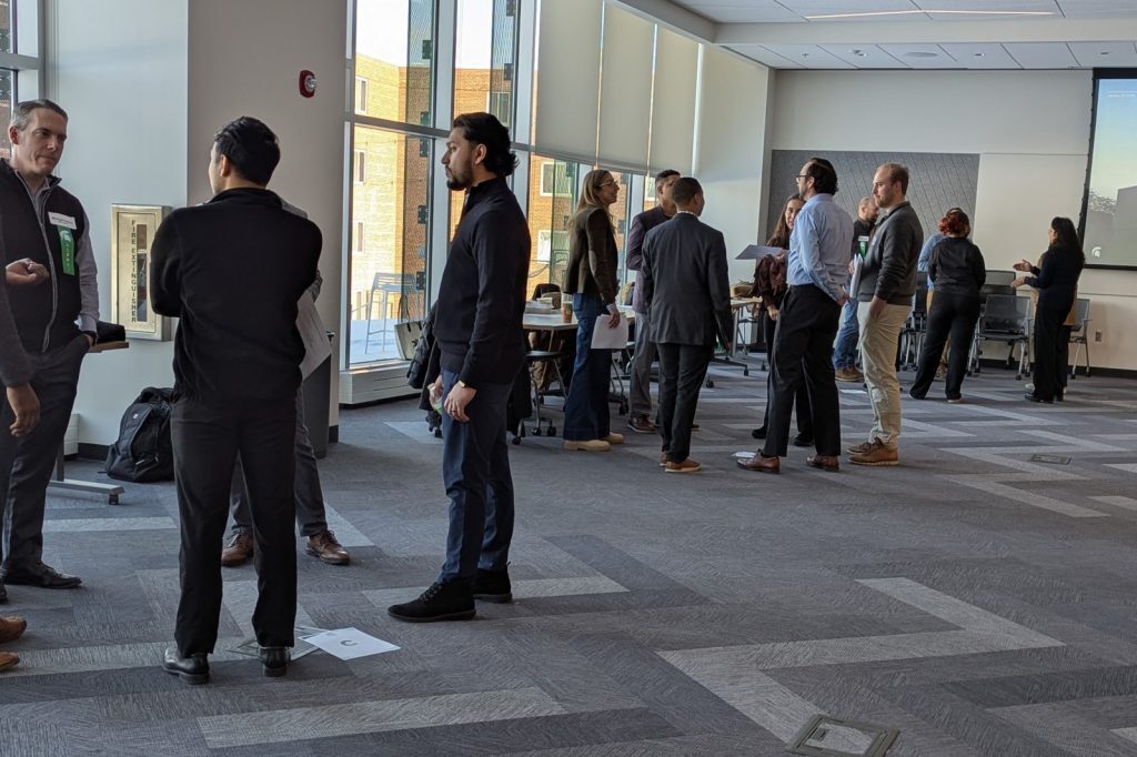 Event participants standing and networking