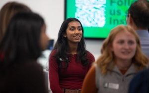 Student in group listening to speaker