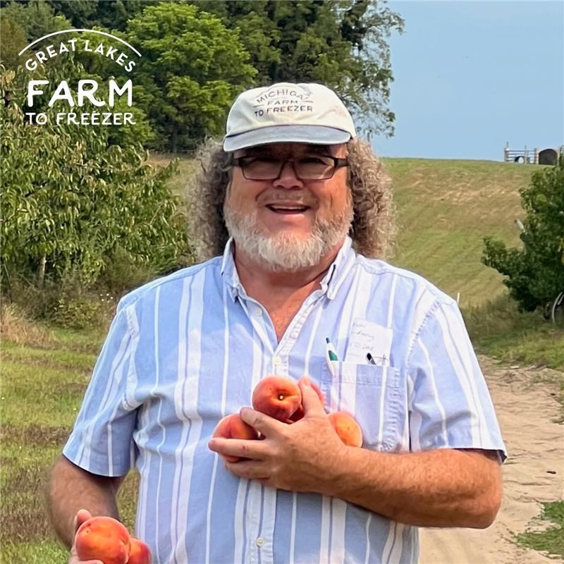 A professional headshot of Mark Coe