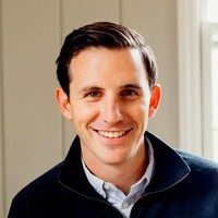 A professional headshot of John Hebert