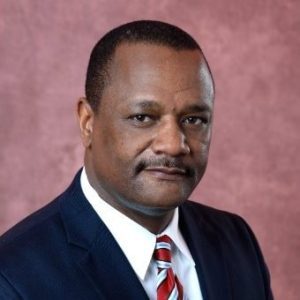 Professional headshot of Issac Kalumbu