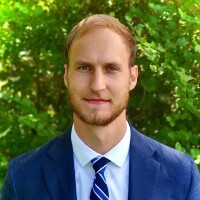 A professional headshot of Benjamin Martynec