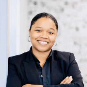 A professional headshot of Monica Johnson.