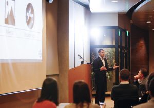 Speaker at podium during pitch a competition