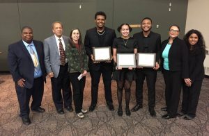Judges pose with the winning team of NABA students