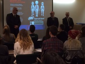 Representatives from Ingersoll Rand give a presentation to an audience of students