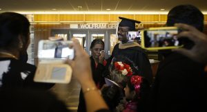 EMBA graduate and family member crying proud tears