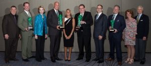 Hospitality Business alumni and their spouses pose for a picture