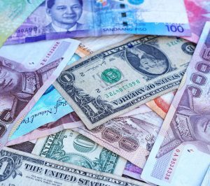 Money from different countries in a pile