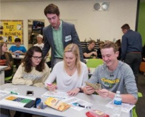 Intern Ryan Vincent checks-in on a group of high school students