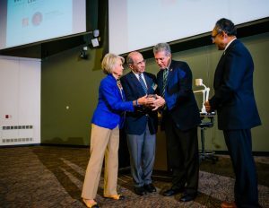 Edward and Jeannine James present Menear with a Warrington Lecture memento.