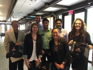 A group photo of MBA students with Wendy's employees.