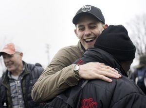 Josh York hugs a person in need.