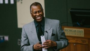 Dr. Lee June reacts to the students' presentations.