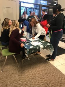 Students line up for the “Suit Up” event Sunday, Sept. 9 at the JCPenney store in Okemos