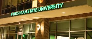 The exterior of the Axia Institute lit up at night in Midland, Michigan.