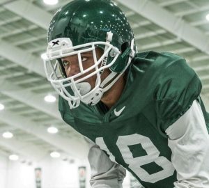 A football player wearing a Xenith helmet