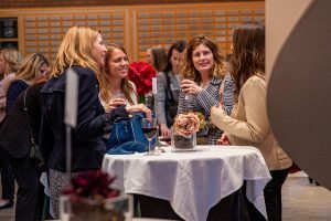Women at the event networking and enjoying beverages