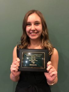 Jessica Mijal poses with the award