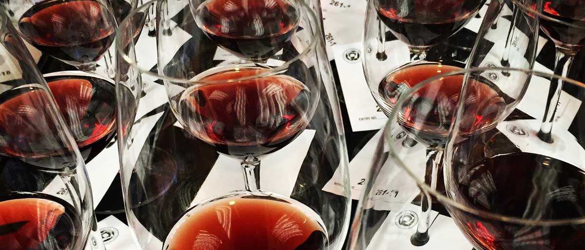 Glasses of red wine sitting on a table at the Kellogg Hotel & Conference Center