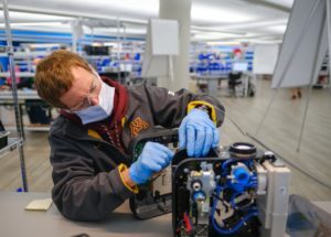 Workers build the first production ventilators at the General Motors manufacturing facility in Kokomo, Indiana.