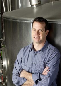 A professional image of Mark Rieth (B.A. General Business ’89), owner of Atwater Brewery onsite