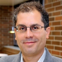 Professional headshot of Tunga Kiyak, executive and managing director of AIB and fixed-term faculty of marketing at the Broad College of Business