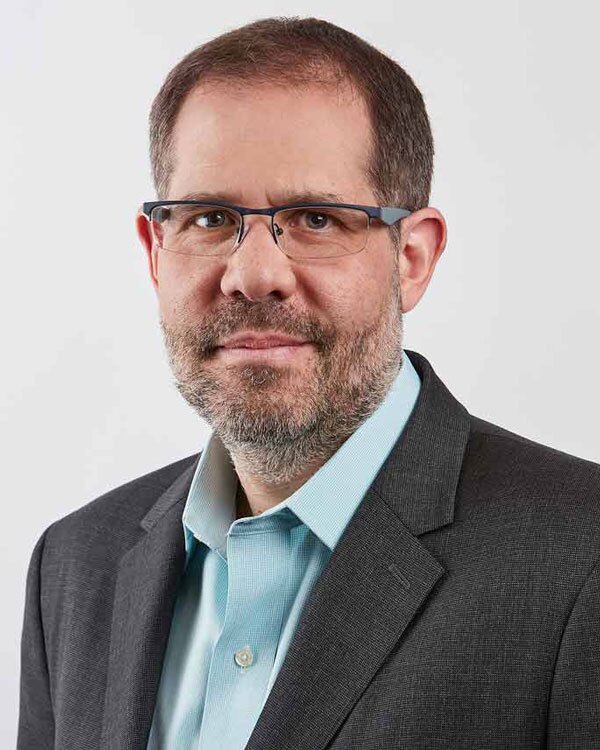 Professional headshot of Alon Kalay, assistant professor of accounting and information systems
