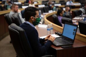 Broad Executive MBA students wearing masks and space out in the Henry Center for the 2021 Global Marketplace