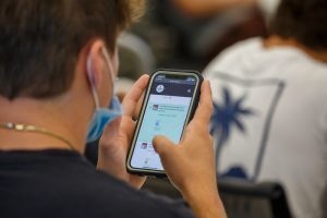 Student using Broad 360 on smartphone