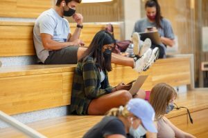 Undergraduate students studying on the stairs in the Minksoff Pavilion